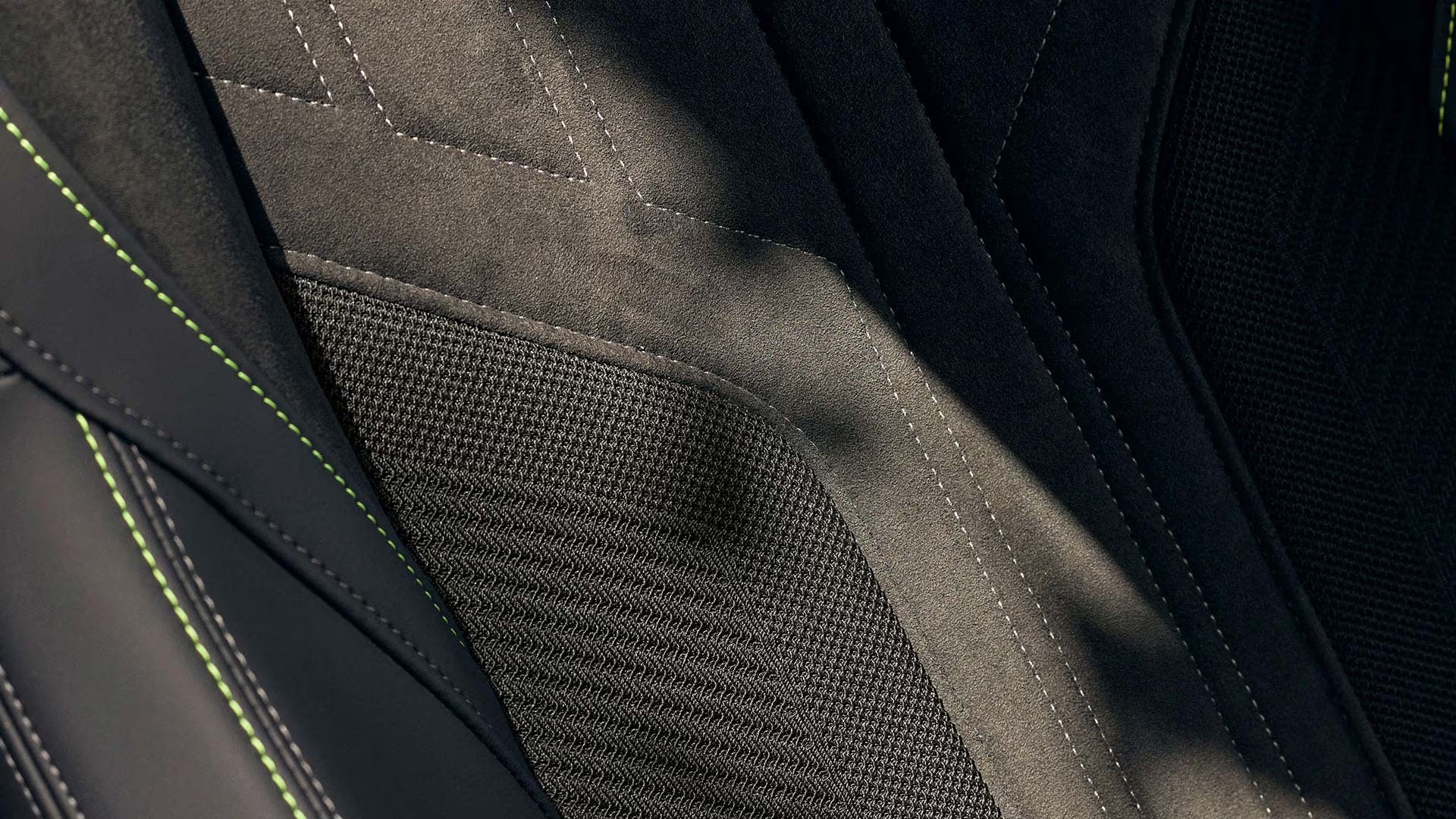 Close-up of car seat fabric with contrasting stitching detail.
