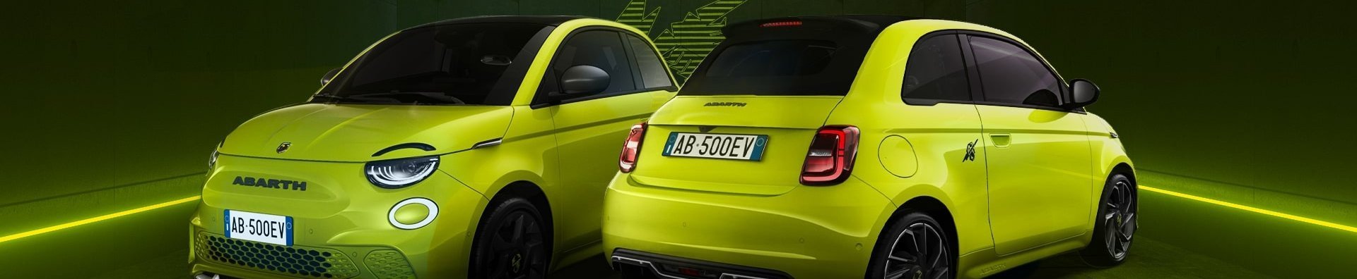 Two lime green Abarth cars, with visible front and rear views.