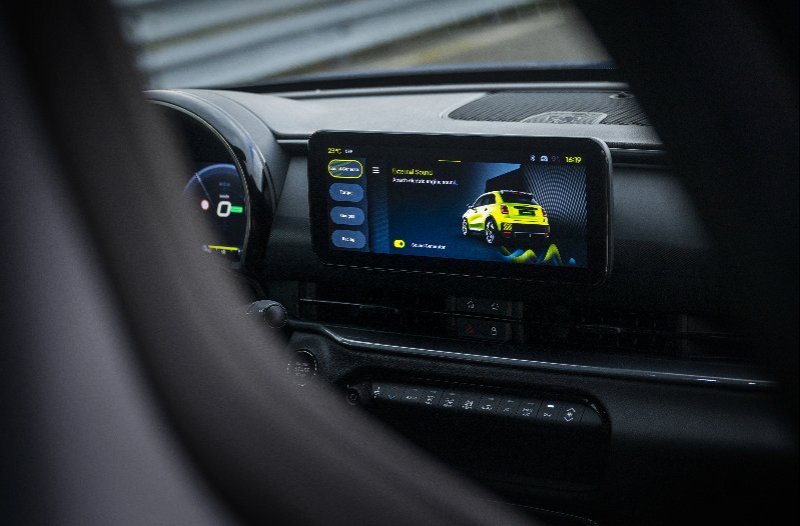 Car dashboard with digital display showing vehicle interface settings.