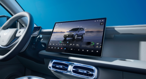 Car dashboard with touchscreen display showing a vehicle interface and controls.