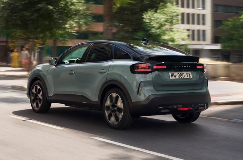 citroen c4 from the rear driving on the road