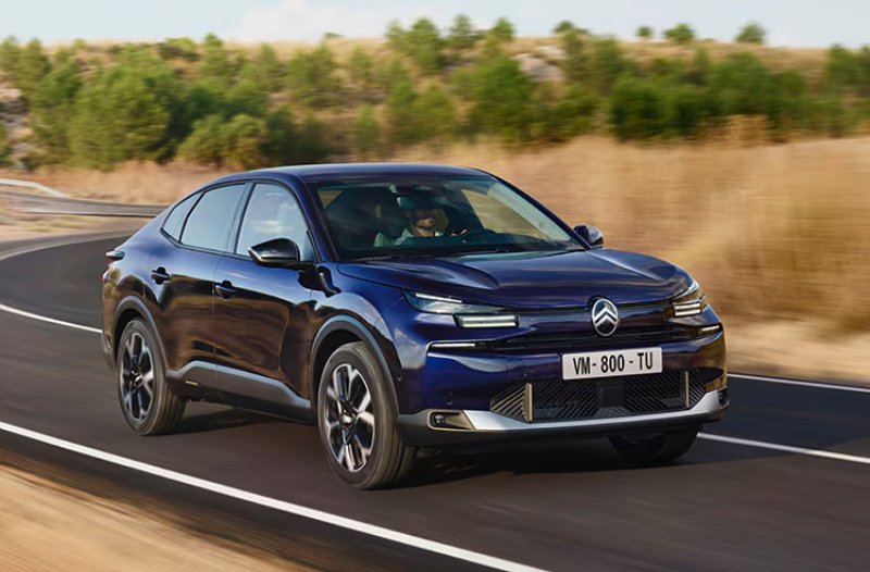 citroen c4 X in blue driving on road