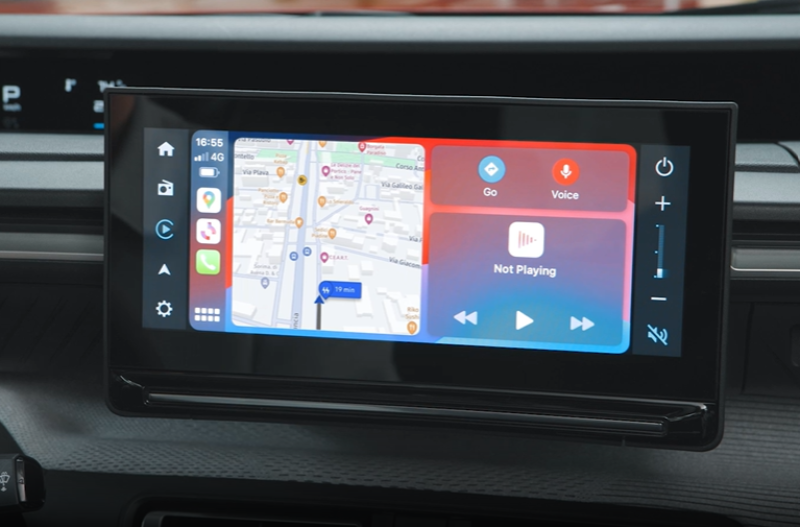 Car infotainment screen with map and audio controls displayed.