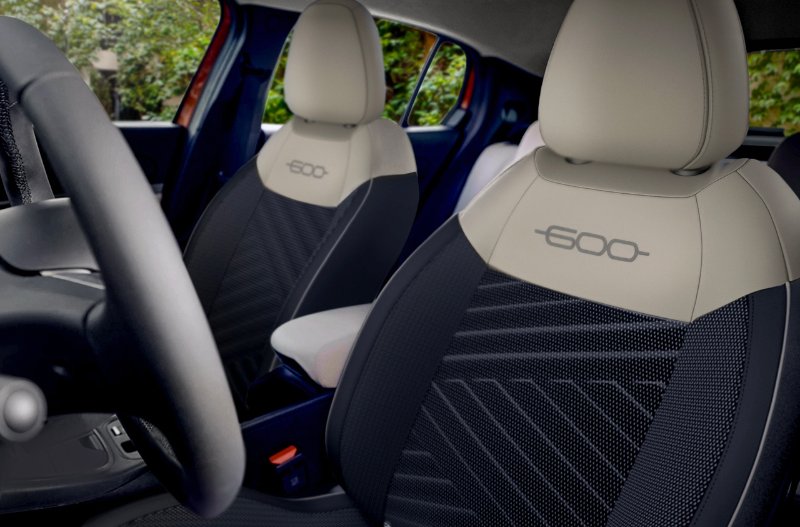Front seats of a car with 600 logo on headrests.
