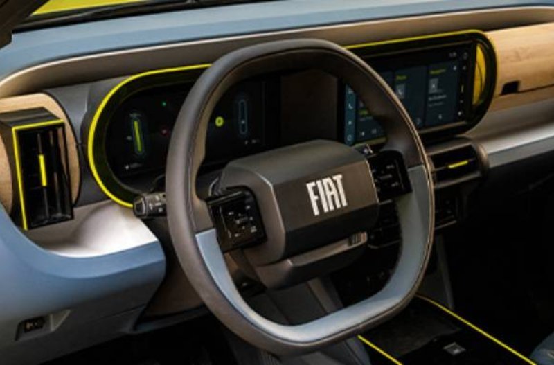 Fiat car interior with steering wheel and digital dashboard display.