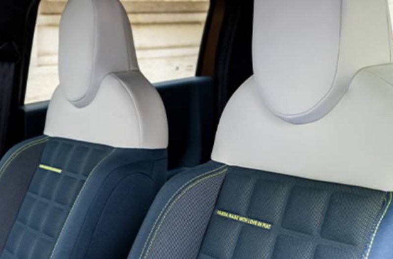 Two-tone car seats with grey upholstery and quilted pattern.