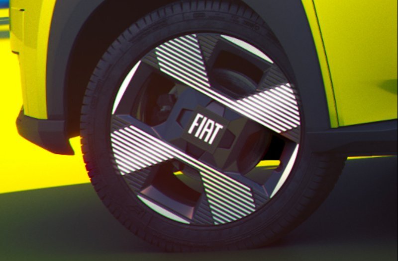 Close-up of a Fiat car wheel with a unique striped pattern on the alloy.