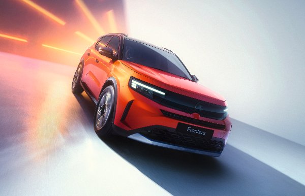 Orange SUV with the word Frontera on the front, angled view with streaks of light.
