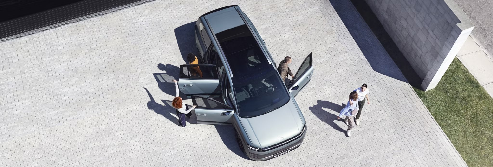 IONIQ 9 from above people getting out of the car