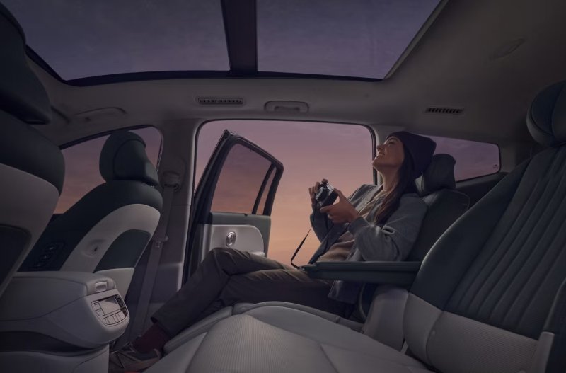 woman relaxing on backseats of the IONIQ 9