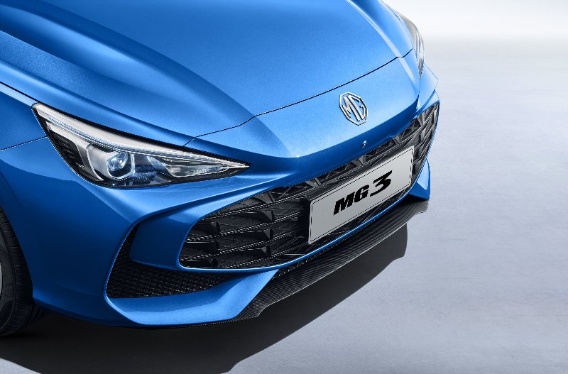 Close-up of the front of a blue MG3 car, showing the headlight and grille.