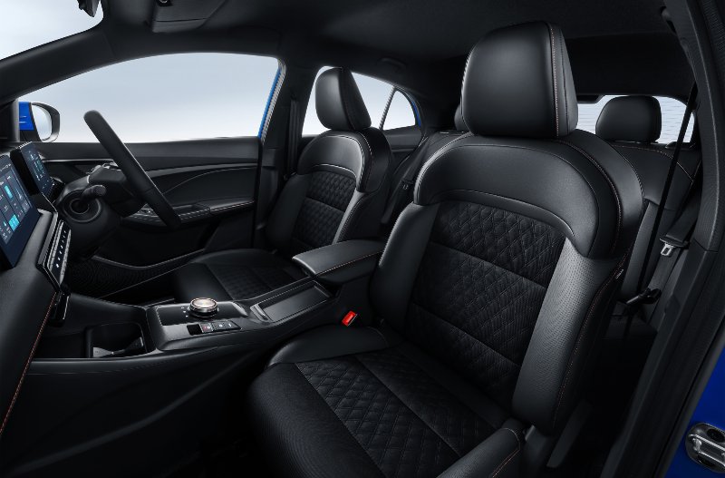 Front seats and dashboard of a car with black leather upholstery.