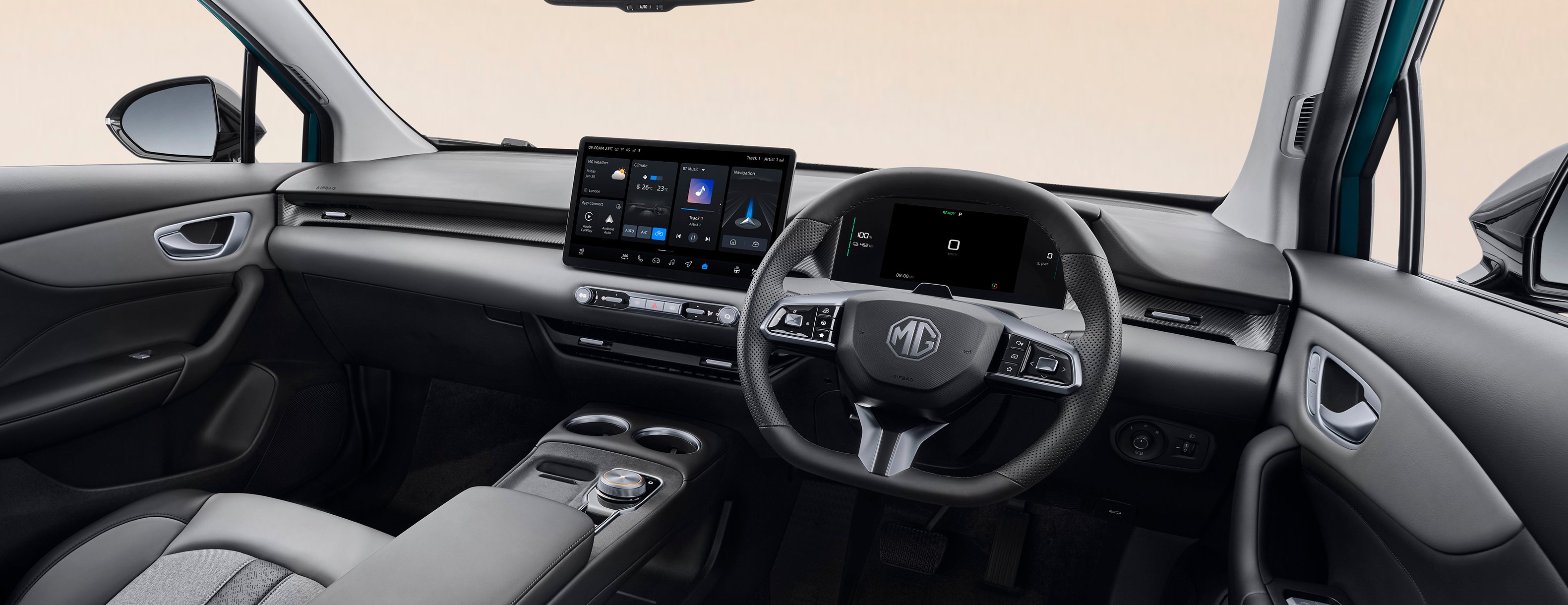 Modern car interior with grey seats and a touchscreen display on the dashboard.