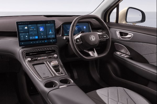 Car interior showing dashboard, dual screens, steering wheel, and centre console.