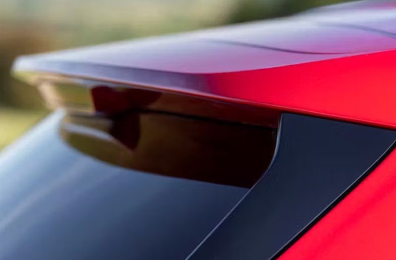Red car spoiler and rear window close-up.