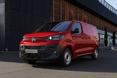 Red Citroën van on a city street.
