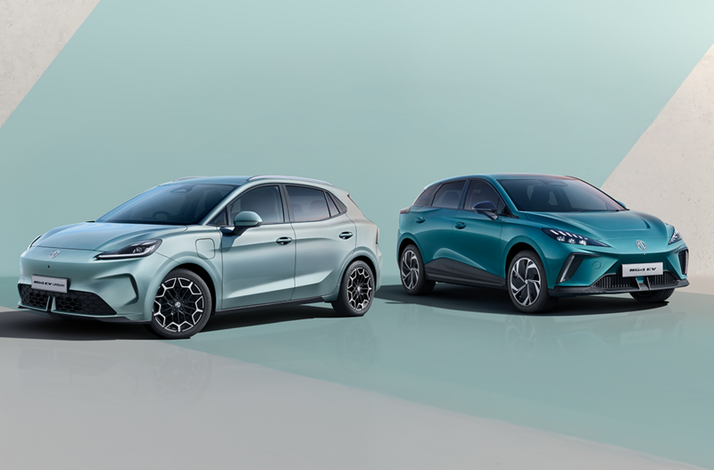 Two electric hatchback cars in silver and blue parked side by side.