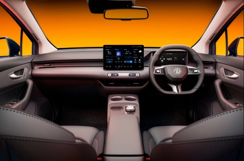 Modern car interior with steering wheel, digital displays, and centre console controls.