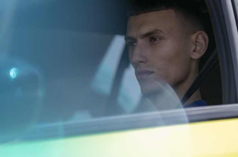 peugeot 208 man looking out window driving