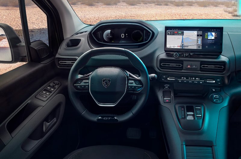 Car interior with dashboard, steering wheel, digital display, and control panel visible.