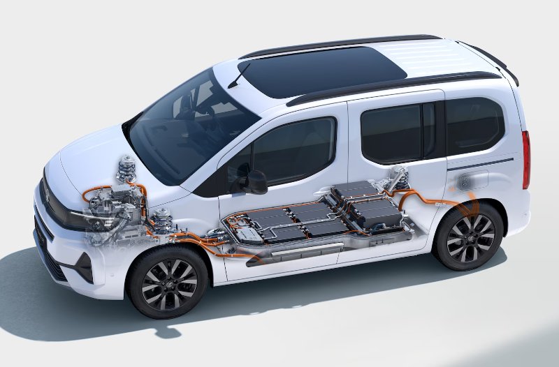 Electric van with visible internal battery and wiring components.